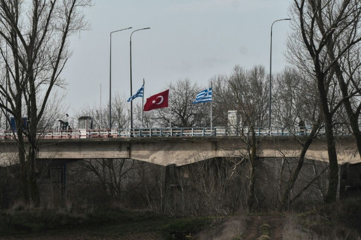 Greek and Turkish flags on a bridge at the border between the the two countries