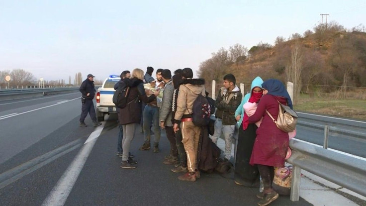 Greek police arrest a group of Syrian migrants with babies and children at sunrise and take their phones, a few kilometres after they crossed into Greece from Turkey.