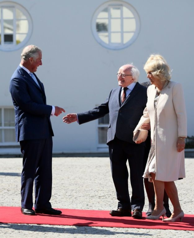 Prince Charles and his wife Camilla have made five trips to Ireland over the last five years. Here they share a joke with President Higgins in 2017
