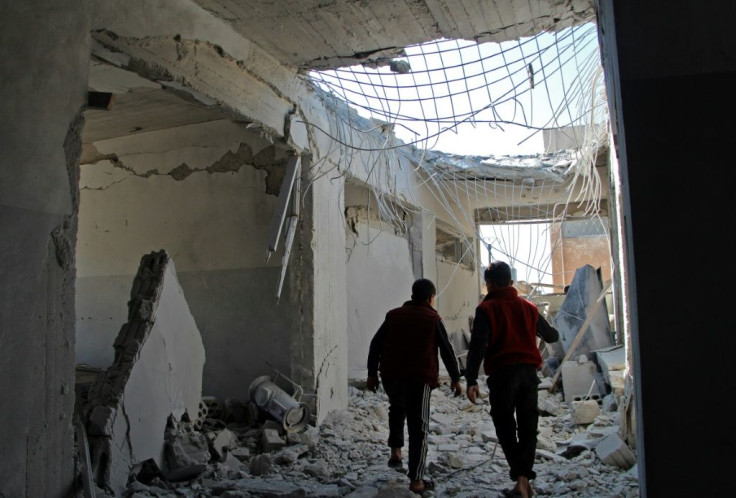 Displaced Syrian children walked through one of the bombed-out schools reportedly targeted in regime air strikes in Idlib province