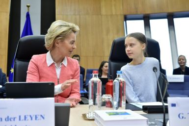 Greta Thunberg (R) calls the climate law championed by European Commission President Ursula von der Leyen (L) insufficient, or in her words, "surrender"