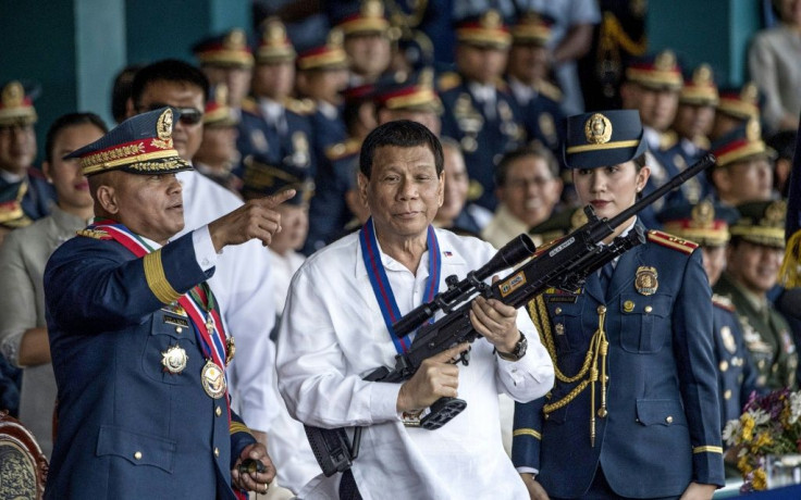 Philippine President Rodrigo Duterte's (C) signature anti-narcotics crackdown has killed thousands and drawn international condemnation