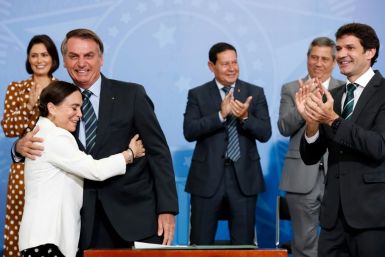 Brazil's President Jair Bolsonaro being hugged by actress Regina Duarte, Brazil's new culture secretary