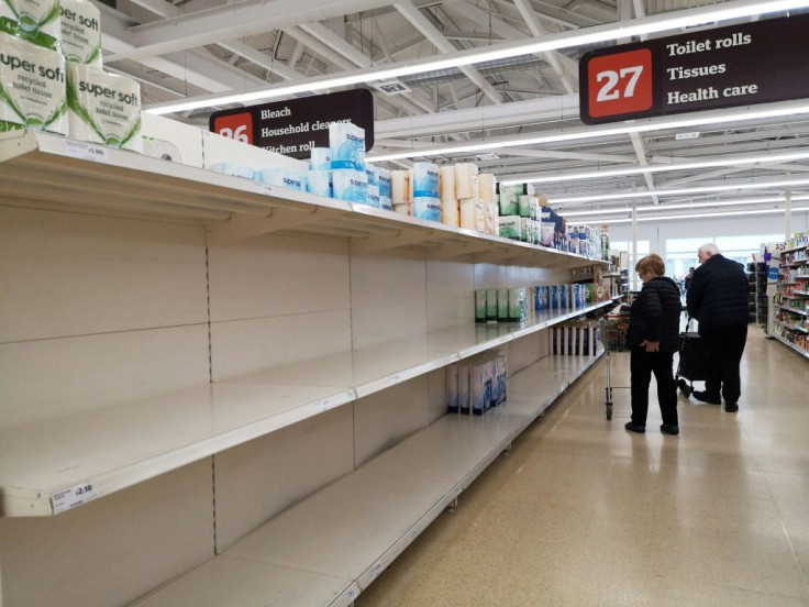 Near empty shelves on the toilet paper aisle in a supermarket in London after stockpiling by consumers