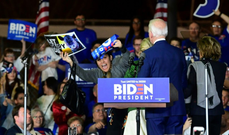 Jill Biden (in green) fended off vegan protestors who rushed the stage at Joe Biden's victory speech