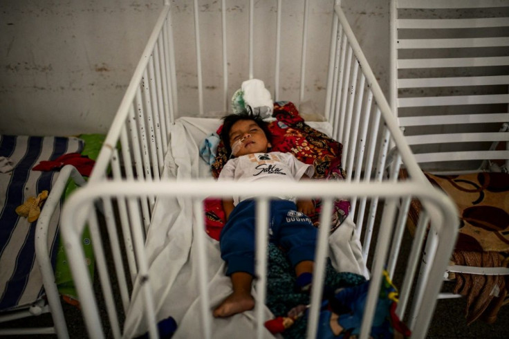 A child hospitalized for malnutrition lies in a hospital bed in Tartagal, Salta Province