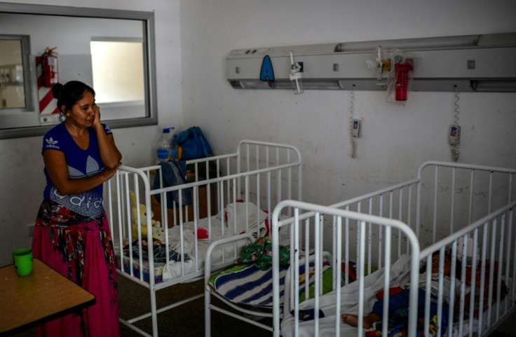 Noelia Perez watches over her son at the Tartagal's hospital