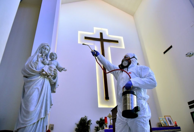 Sanitary workers disinfect a church in Beirut, Lebanon