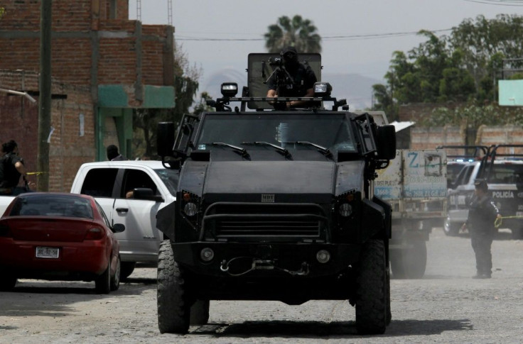 Police patrol after nine people were killed in the La Huertas neighborhood of Tlaquepaque, Mexico