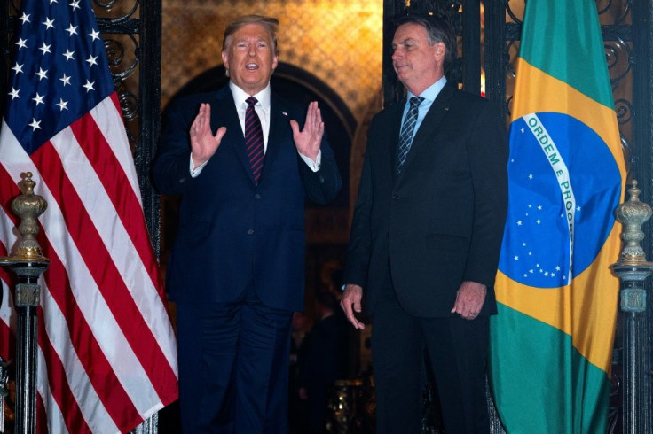 President Donald Trump struck a defiant tone as he spoke about the COVID-19 outbreak at his Mar a Lago resort in Florida, where he hosted his Brazilian counterpart Jair Bolsonaro (R)