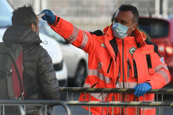 The body temperature of a man arriving at the Juventus stadium is checked