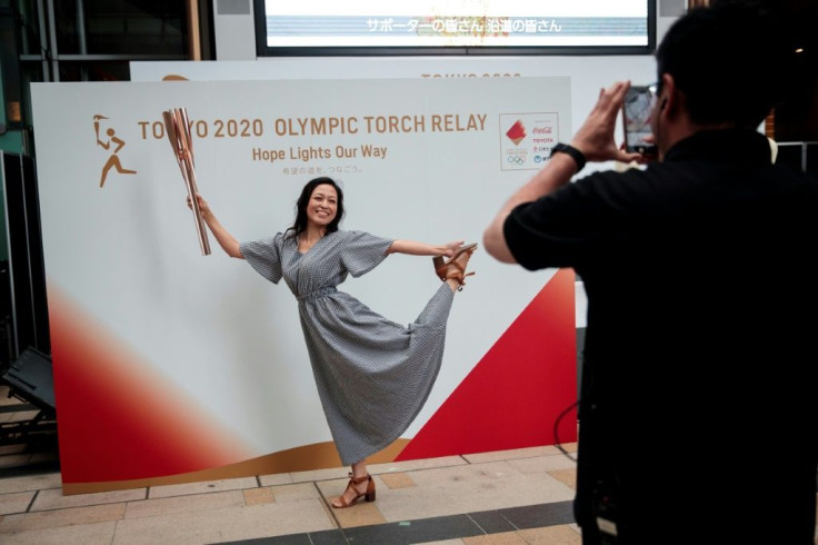The Olympic torch relay will travel though many of the areas devastated by the disaster, under the slogan 'Hope Lights Our Way'