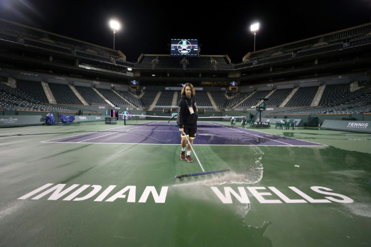 The center court at Indian Wells Tennis is cleaned on Sunday as the WTA/ATP became the first big US sports event to be cancelled because of the coronavirus