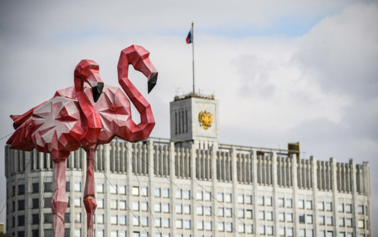 Flamingo statues stand in front of Russia's government building as the ruble tumbled on March 9 to a four-year low amid a crash in oil prices
