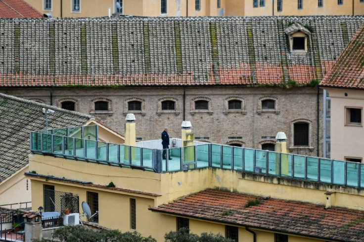 A prison guard patrols a rooftop terrace at the   Regina Coeli prison in central Rome
