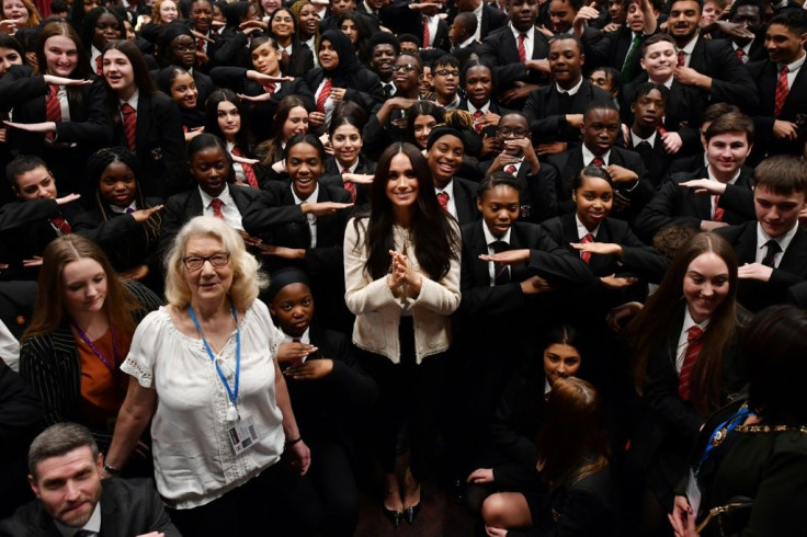 Meghan drew shrieks of delight from schoolchildren during an unannounced school visit Friday in Dagenham, east London