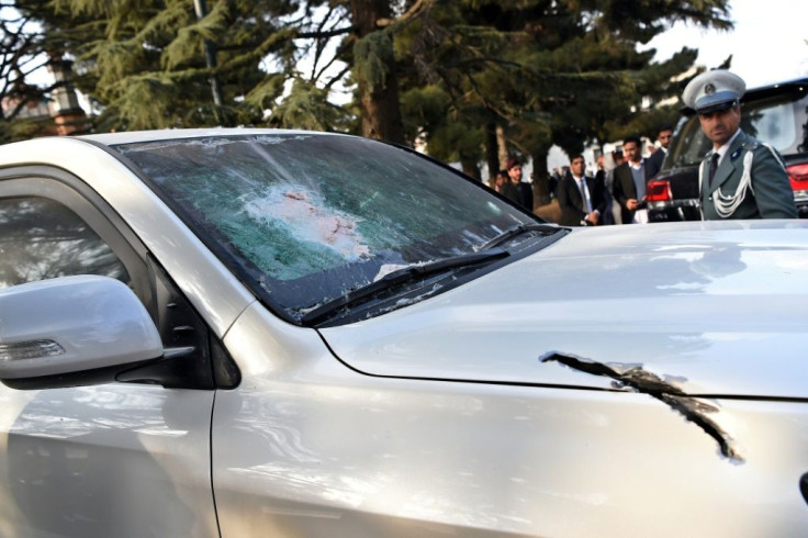 Damage to an armoured official vehicle hit by shrapnel after rockets struck downtown Kabul near the presidential palace during the inauguration of Afghan President Ashraf Ghani