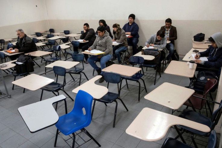 Male students attend a class at the Universidad Autonoma de Baja California in Tijuana, Mexico as women stayed away in the nationwide 'A Day Without Us' protest against gender violence