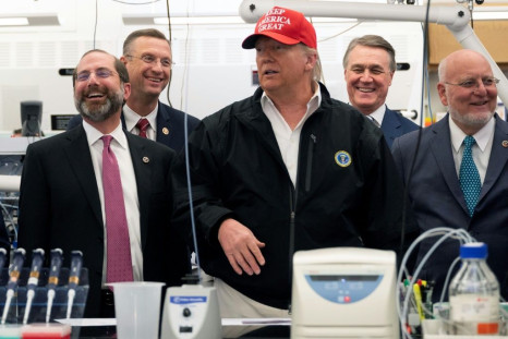 Representative Doug Collins (2L), was with President Donald Trump (C) during a coronavirus briefing at the Centers for Disease Control and Prevention headquarters