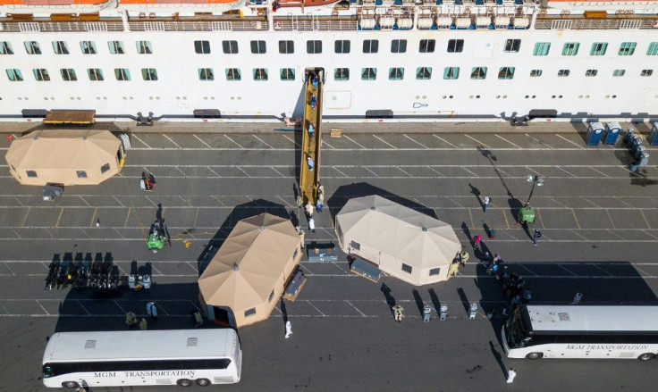 More passengers leave the Grand Princess cruise ship at the Port of Oakland in Oakland, California