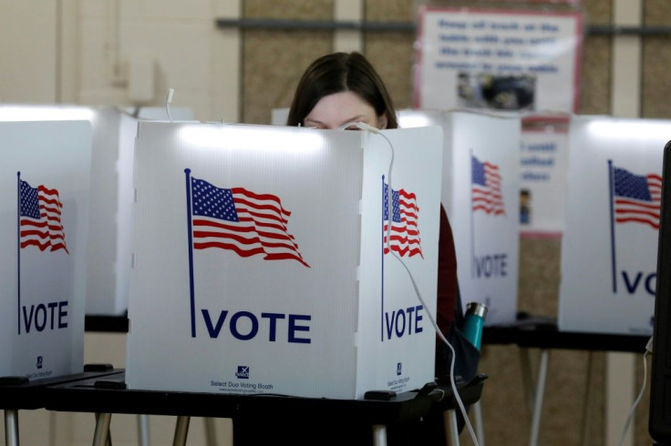 People vote in the Michigan primary election at Chrysler Elementary School in Detroit