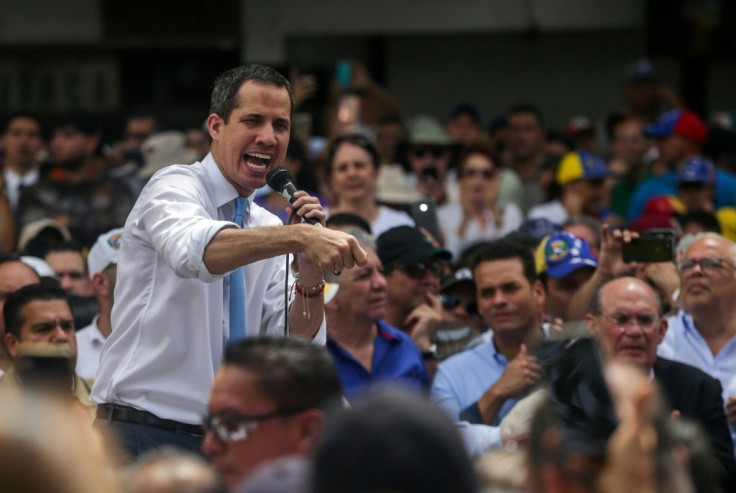 Juan Guaido addresses supporters during a march blocked by police in Caracas on Tuesday