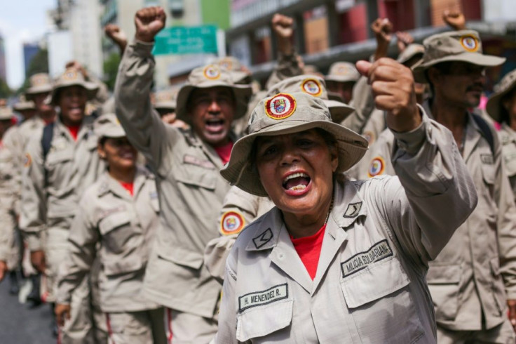 Members of the Bolivarian militia and supporters of the Venezuelan President Nicolas Maduro take part in a demonstration in Caracas on Tuesday