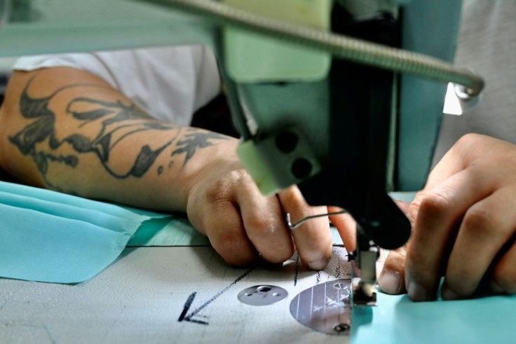 The inmates work quickly with machines they have clearly come to know well