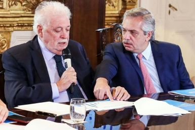Argentina's President Alberto Fernandez (R) and Health Minister Gines Garcia at a cabinet meeting on tackling the coronavirus outbreak