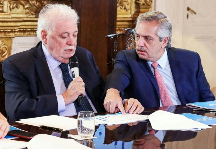 Argentina's President Alberto Fernandez (R) and Health Minister Gines Garcia at a cabinet meeting on tackling the coronavirus outbreak