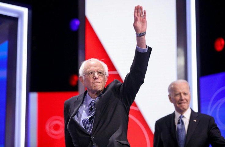 Despite a string of losses to Joe Biden (R), Bernie Sanders (L) says he's staying in the nomination race