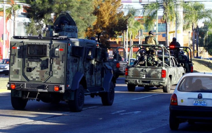 Mexican soldiers with an armoured car patrol the streets during a 2014 operation against the Jalisco Next Generation narcotics cartel