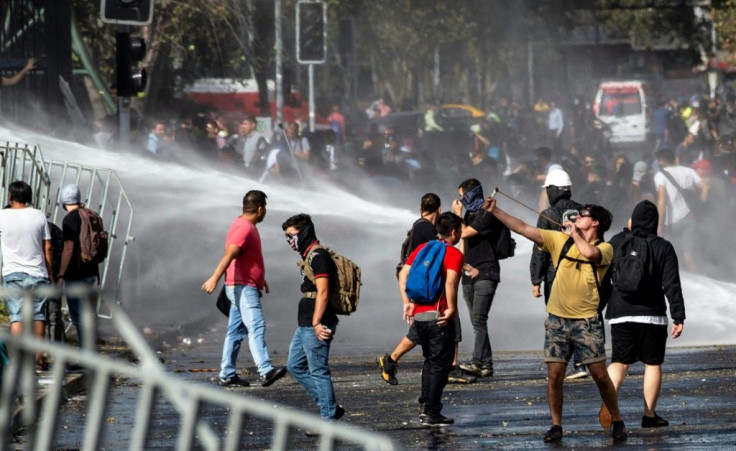 The protests coincided with the 30th anniversary of Chile's return to democracy after Augusto Pinochet's 1973-1990 dictatorship