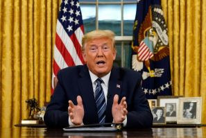 US President Donald Trump addresses the nation from the Oval Office about the widening novel coronavirus crisis