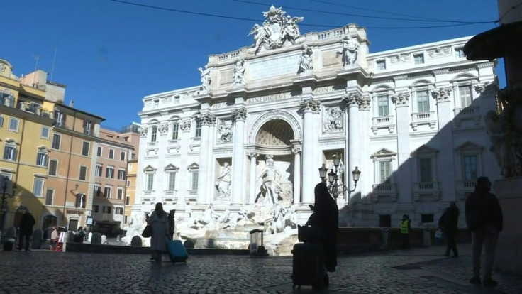 The usually tourist-thronged Trevi fountain in Rome is quiet as Italy imposes drastic measures to try and stop the spread of the coronavirus.