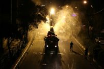 Iranian firefighters disinfect streets in Tehran to tackle the spread of coronavirus