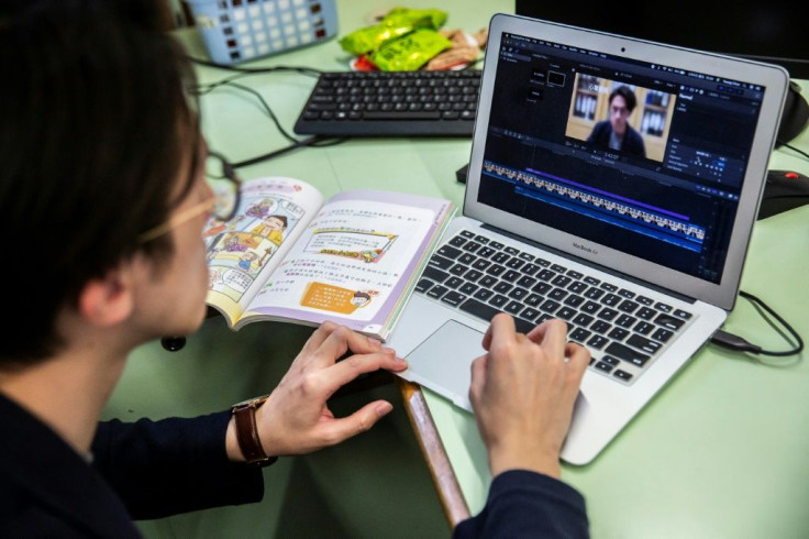 A teacher in Hong Kong prepares a lesson for students whose classes have been suspended, a growing phenomenon due to the global coronavirus outbreak