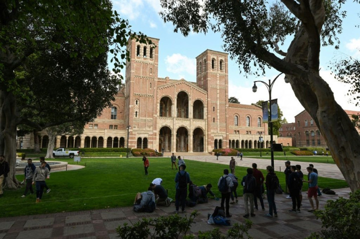 Students gather on the campus of University of California at Los Angeles (UCLA) in Los Angeles, among the schools suspending in-person classes due to coronavirus concerns
