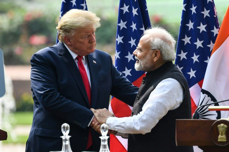 US President Donald Trump shakes hands with India's Prime Minister Narendra Modi