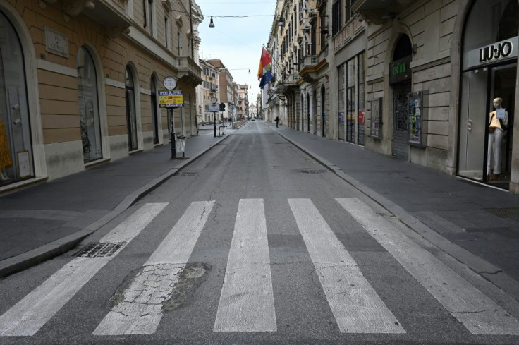 A deserted Via del Corso main shopping street in Rome, as Italy shut all stores except for pharmacies and food shops in a desperate bid to halt the spread of a coronavirus