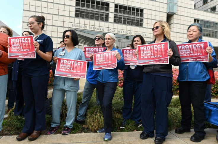 Nurses protest what they call the weak US response to the novel coronavirus outside the UCLA Medical Center in Los Angeles