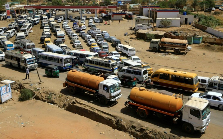Sudanese motorists queue for as long as six hours to fill up, a heavy burden for the many who make their living from their vehicles