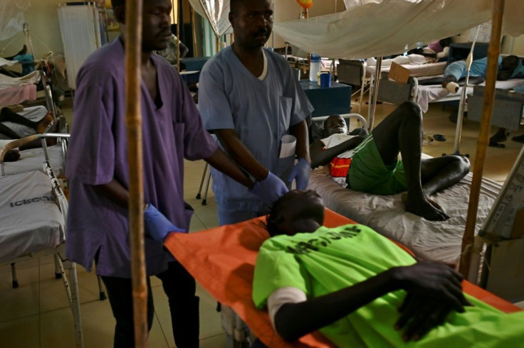 Hospital wards overflow with young men disfigured by machine gun fire