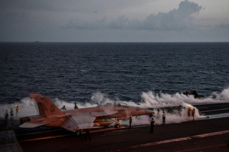 A F18-C Hornet fighter jet waits to take off from the deck of USS Harry S. Truman, one of two US aircraft carriers the Pentagon is keeping in the Gulf region amid tensions with Iran