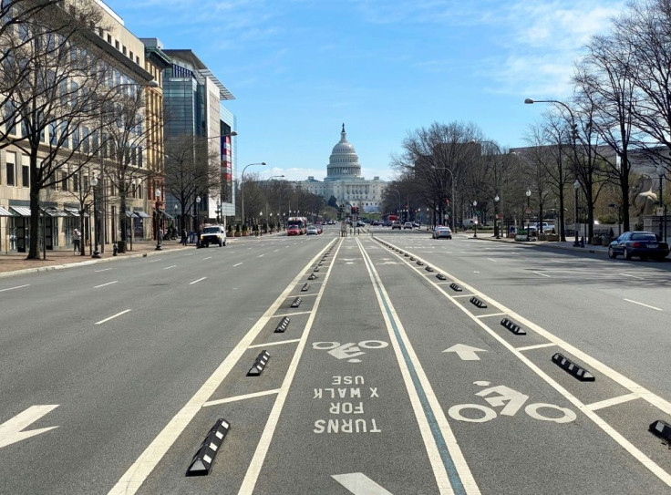 An almost empty Pennsylvania Avenue is seen in Washington as coronavirus puts American life on hold