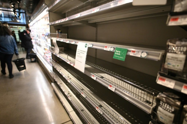 Many shelves across the US stand empty as Americans stock up as coronavirus slows life down