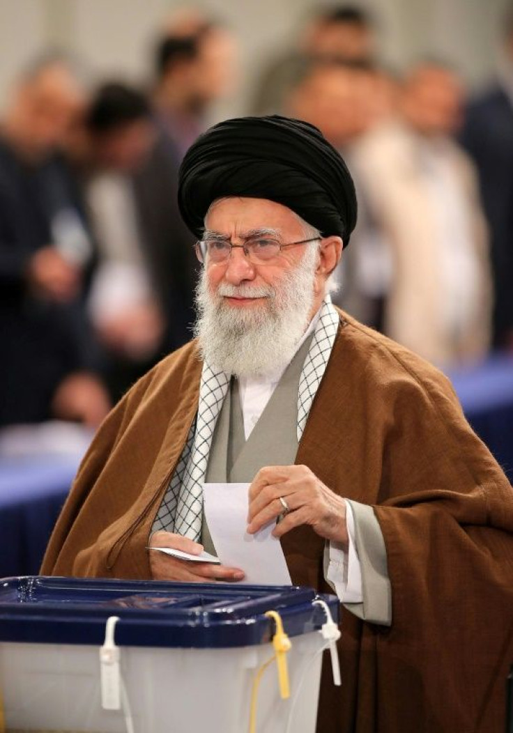 Iran's Supreme Leader Ayatollah Ali Khamenei casts a ballot in February 2020 parliamentary elections in a photo distributed by his office
