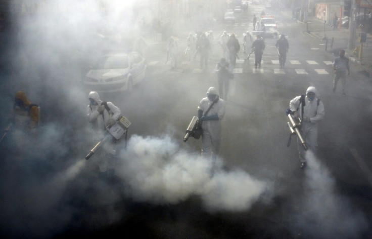 Firefighters disinfect streets in the Iranian capital Tehran in a bid to stem the spread of the coronavirus