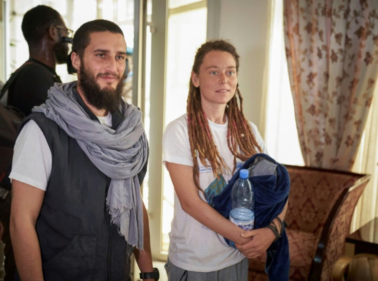 Luca Tacchetto and Edith Blais appeared slightly disoriented when they landed in Bamako