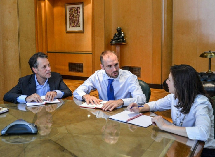 Argentina's Economy Minister Martin Guzman (C); IMF Deputy Director for the Western Hemisphere Julie Kozack (R) and IMF Mission Chief Luis Cubeddu meet in Buenos Aires on February 14
